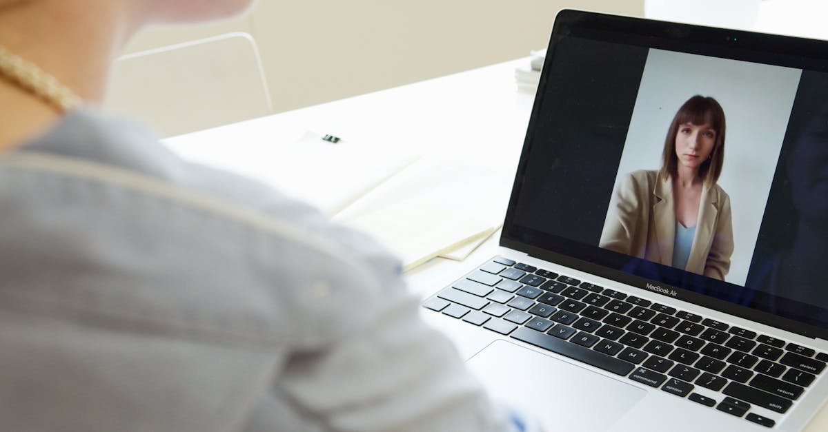 Person notarizing a document online by video call from home